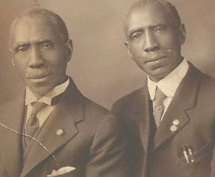Photo of Charles Henry and James Lewis Turner posing; sepia-toned