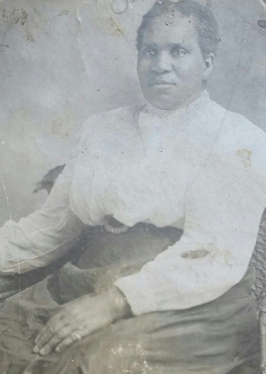 Photo of Amanda Love Estes, posing in a tin-type style photo